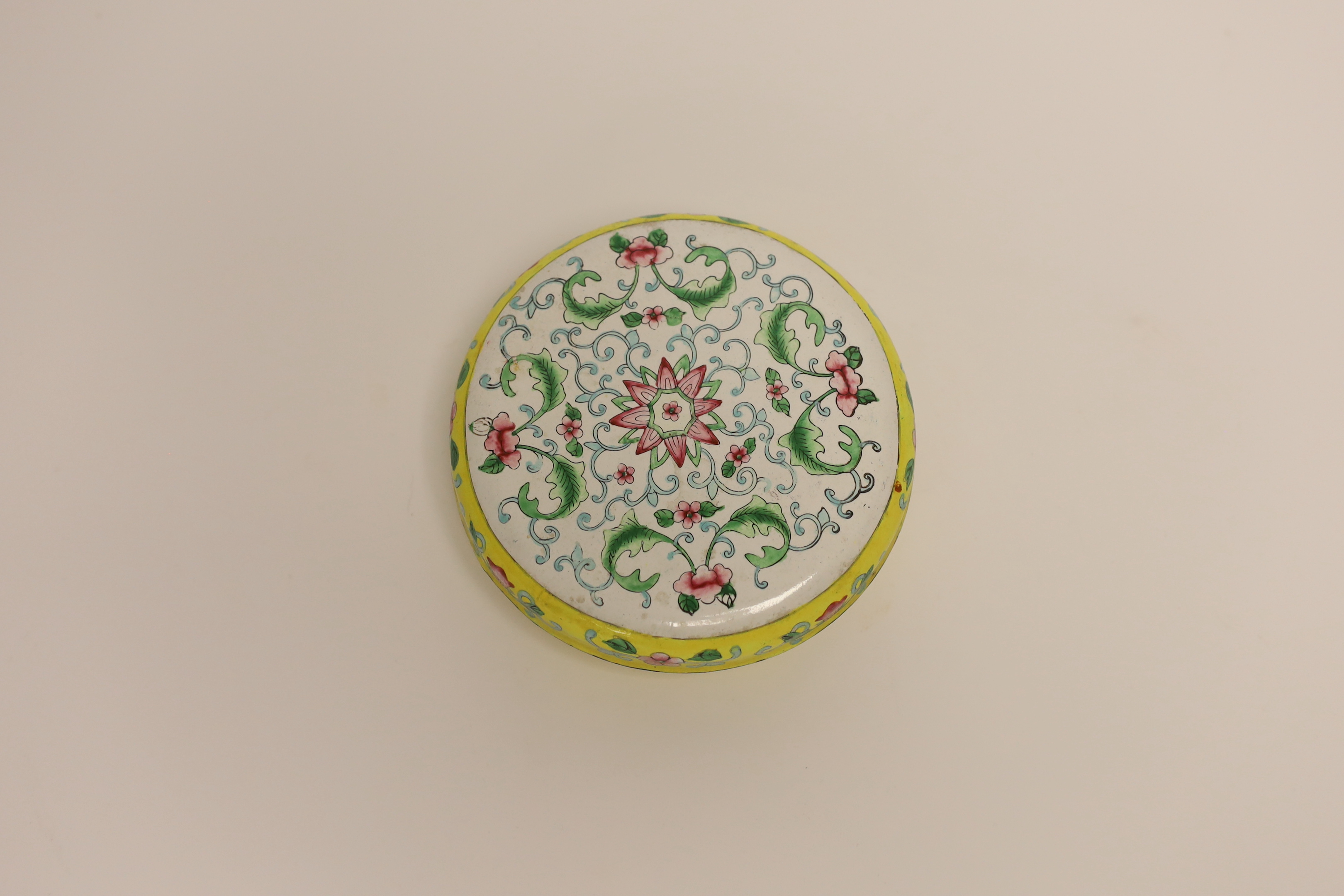 A Chinese Canton enamel circular box and cover, 13cm diameter